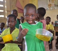 Ghana School child enjoying lunch